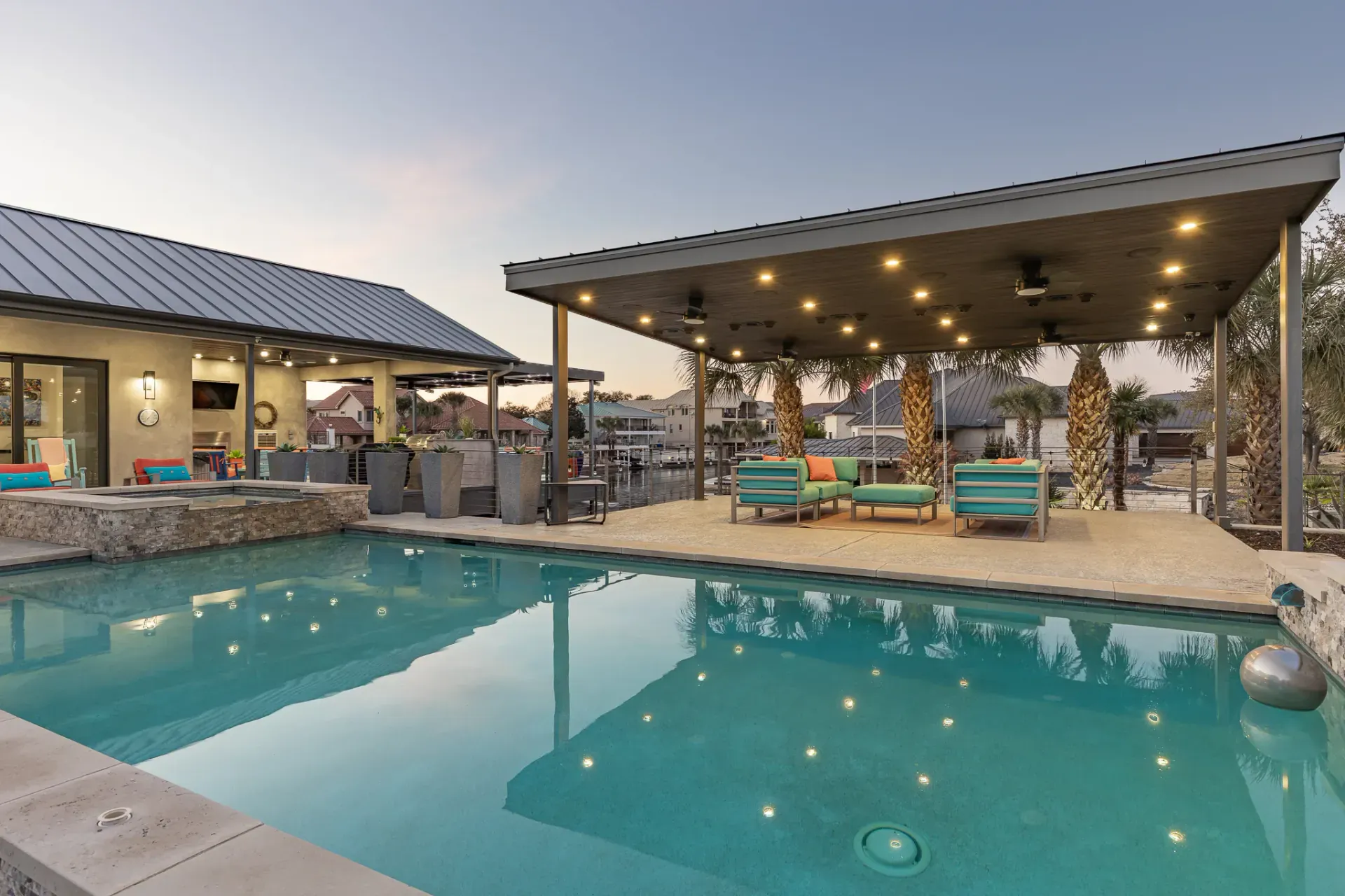 Pool and cabana illuminated at twilight